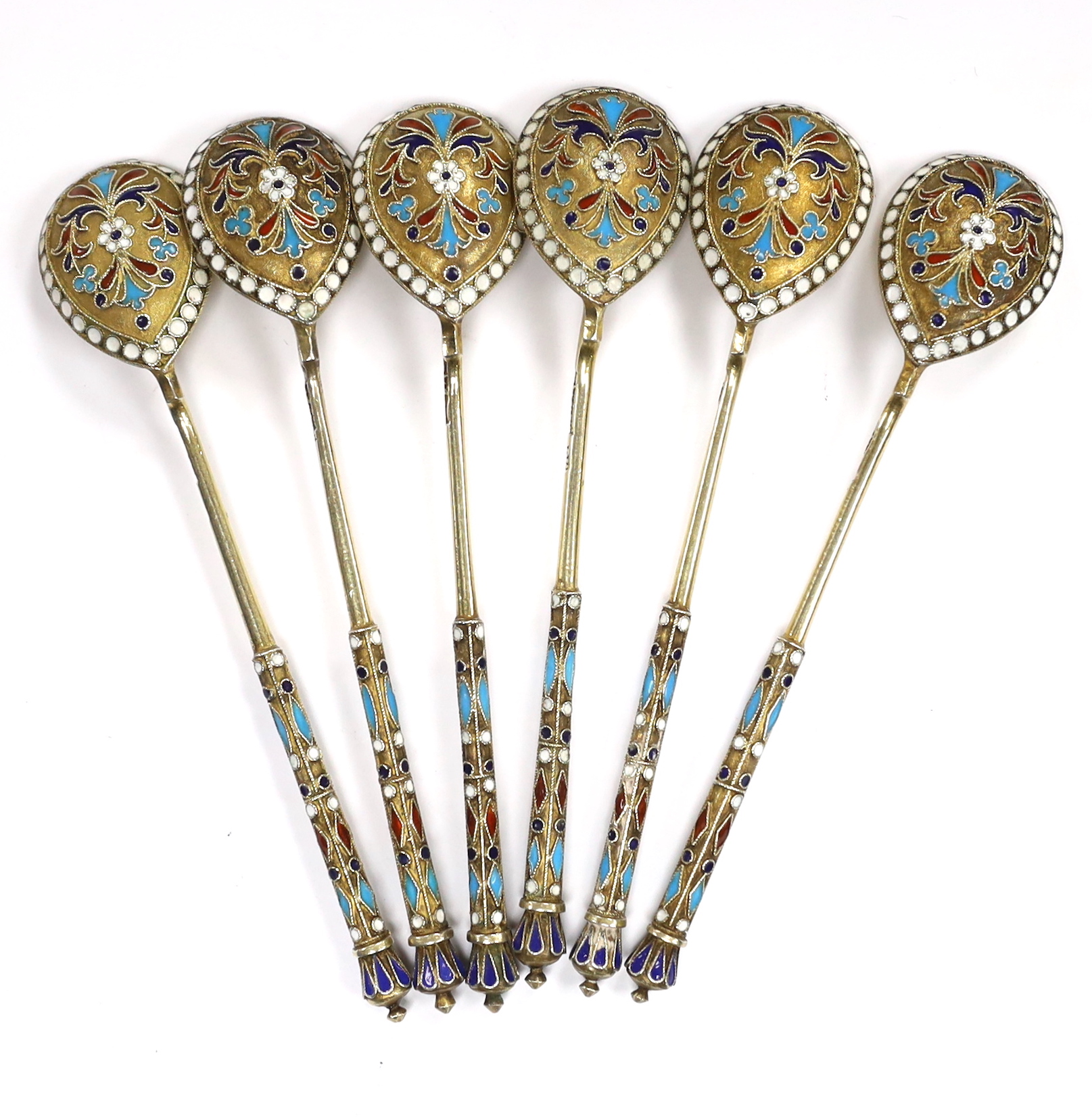 A set of six late 19th century Russian 84 zolotnik gilt white metal and cloisonné enamel coffee spoons, 11.4cm, gross 92 grams.